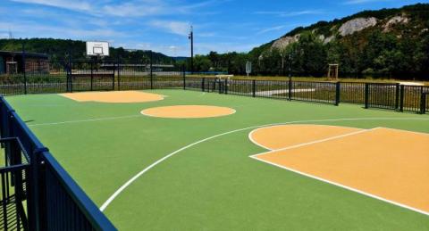 sol sportif en caoutchouc coulé vert et jaune